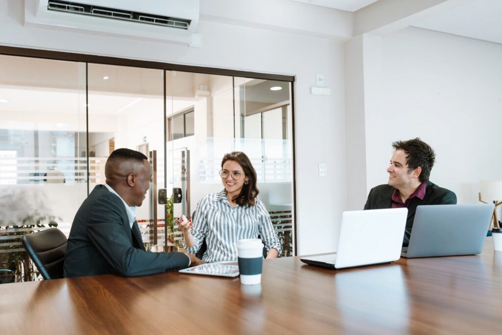 Business people having a relaxed conversation in a meeting room